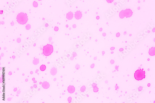 light pink background stained with multiple pink paint spots