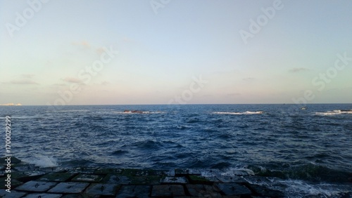 Mediterranean Sea Waves at Sunset – Alexandria Skyline
