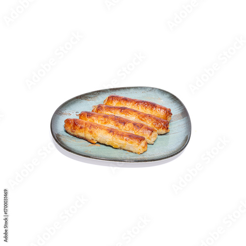 Pencil pastry. Pastry served on a plate. Cigarette pastry. Turkish cuisine.