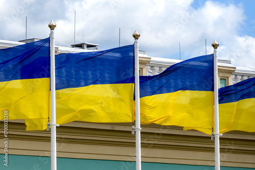 Ukrainian national flags wave on flagpoles near the Mariinsky Palace in Kyiv during Ukraine Independence Day celebrations on August 24, 2025