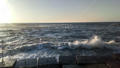 Mediterranean Sea Waves at Sunset – Alexandria Skyline
