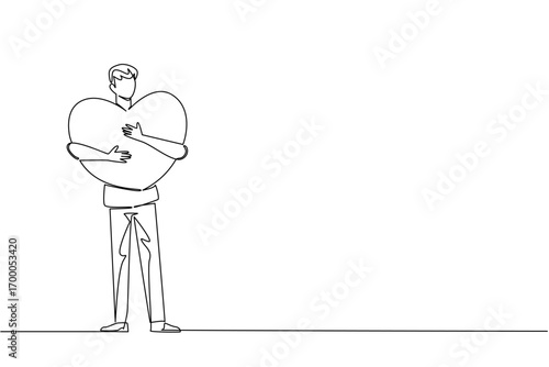 A continuous line drawing of a young man hugging a large heart close to his chest, symbolizing care, affection, and unity for Love Conquers All Day in a relationship and compassion concept.