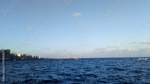Mediterranean Sea Waves at Sunset – Alexandria Skyline