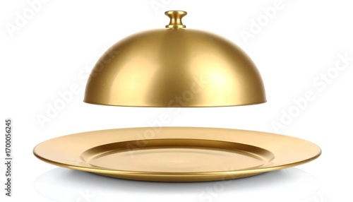A golden cloche resting above a polished golden platter against a plain white background.