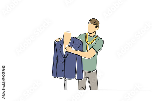 A young man tailor measures a formal jacket on a mannequin with tape in continuous line drawing style, highlighting business concept and skill craftsmanship for National Tailors Day theme.