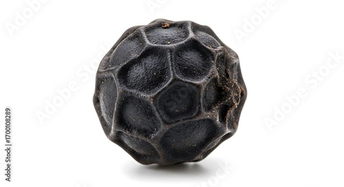 Single black peppercorn isolated on a white background, showcasing its textured surface and dark color.