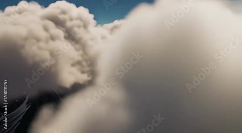 Majestic clouds soar through a vast, bright sky, hinting at a world below.