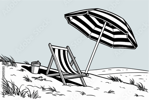 Striped beach umbrella and chair on a sandy dune