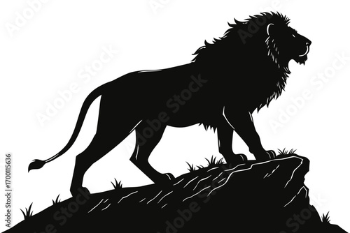 Majestic lion silhouette standing on rocky outcrop