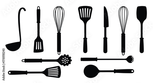 Collection of assorted cooking utensils including ladles spatulas whisks and knives
