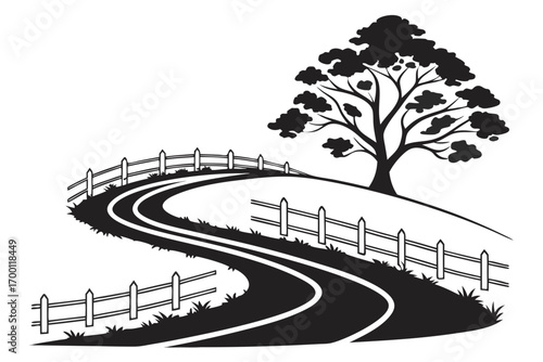 Winding country road with a tree and fence