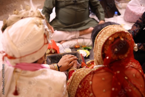 Wallpaper Mural Bride and Groom Holding Hands During Hindu Wedding Ritual with Priest Torontodigital.ca