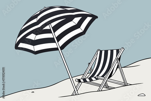 Striped beach umbrella and deck chair on sandy dunes