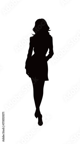 A confident woman walks gracefully, her silhouette highlighted against a simple background. She exudes elegance and style, showcasing fashion artistry.