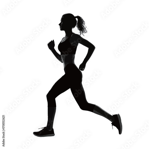 A woman is captured in silhouette as she jogs energetically, showcasing her athletic wear and form against a stark backdrop. This moment highlights movement and fitness.
