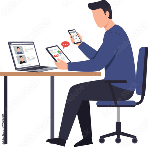 Businessman working on multiple devices at his desk.