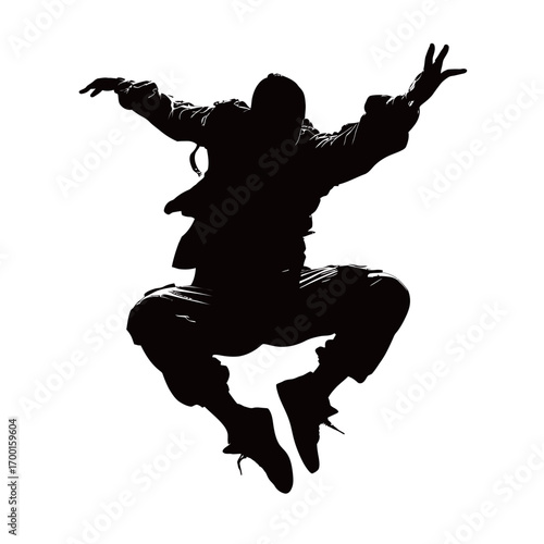 A person is captured in mid-air, leaping with energy and enthusiasm. The silhouette showcases an impressive athletic pose, emphasizing motion and freedom.