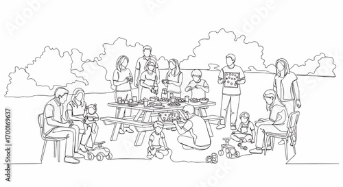 A large family or group of friends enjoying an outdoor picnic gathering in a park, with adults and children eating and socializing around a picnic table.