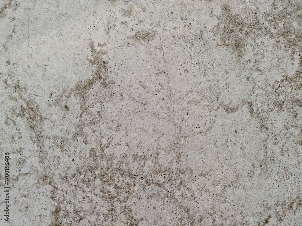 Fototapeta premium Close up of rough concrete wall with stains and weathered texture