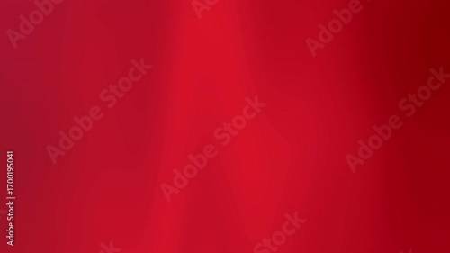 Abstract animated background featuring smooth flowing gradient in vibrant red tones from crimson to burgundy.