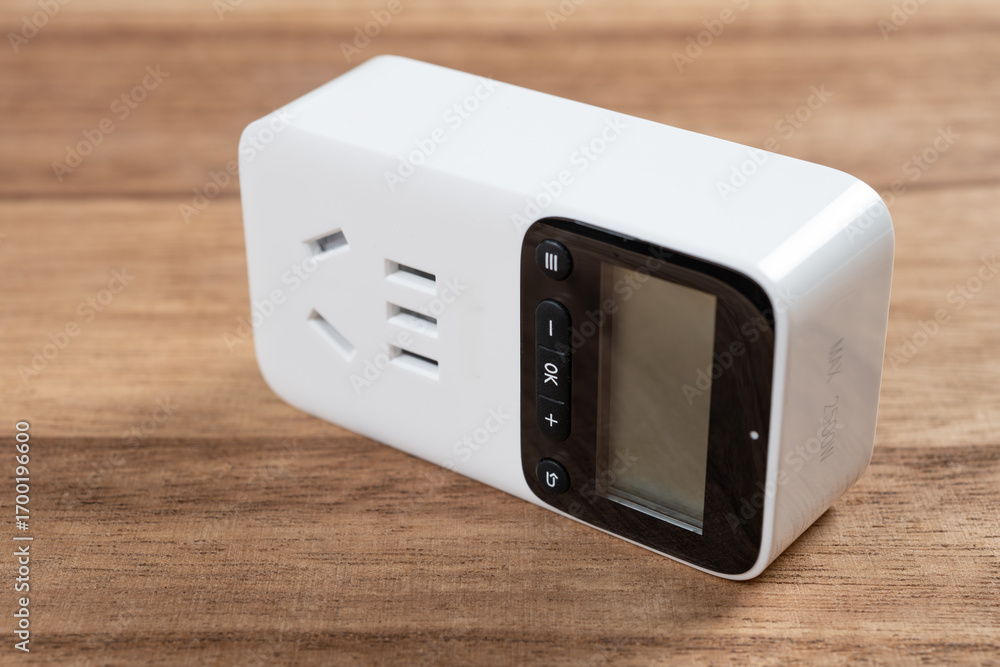 Obraz premium a digital timer plug with control buttons