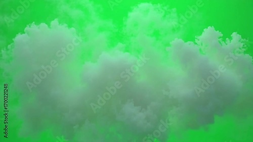 Wispy white cloud drifts across a vibrant green background for compositing.