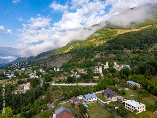 Mestia, Georgia, revealing its breathtaking landscape with houses, river, and majestic mountains