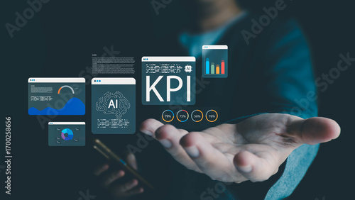 Tableau sur toile A person holds out a hand, presenting virtual interfaces with KPI data, AI brain icons, and charts, visualizing business intelligence and performance analytics on a dark background