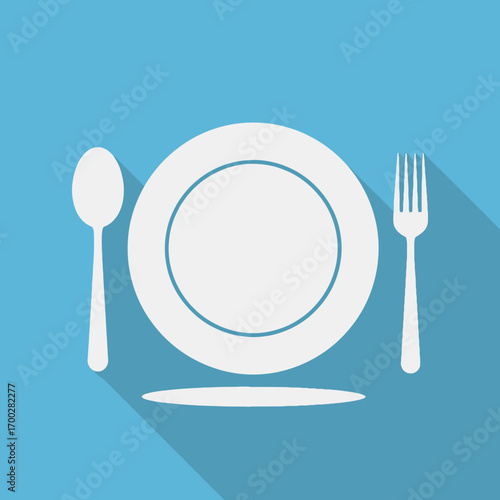 Dining Utensils and Plate on a Table.
