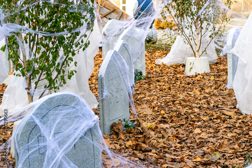 A spooky Halloween graveyard with tombstones and spiderwebs The Perfect Haunted Scene