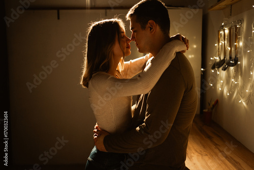 Εκτύπωση καμβά Young kissing passionate couple having a romantic date at home celebrating Valen