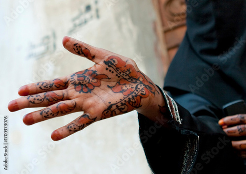 Somali refugee showing her hands tattooed with henna, Mecca province, Jeddah, Saudi Arabia