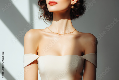 closeup of woman shoulders emphasizing interplay of shadows and forms