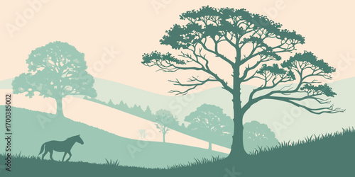 Horse grazing in a green hilly landscape with silhouetted trees