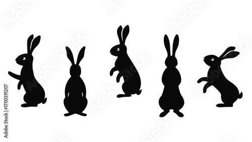 Collection of black rabbit silhouettes in various playful poses on a white background