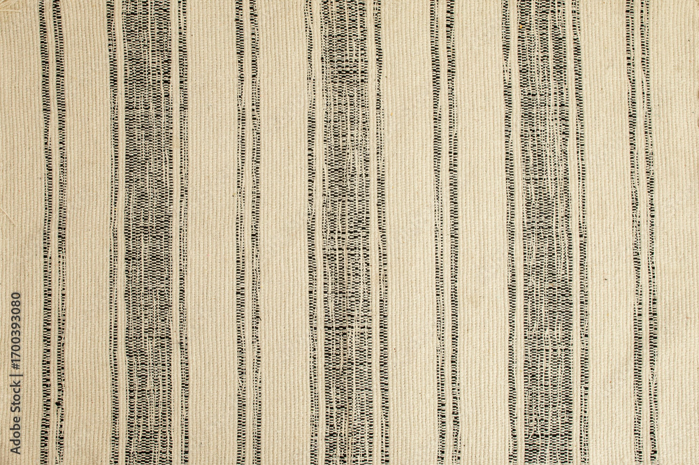 Obraz premium Rustic retro patterned rug or carpet, abstract textured backdrop, flat lay close up