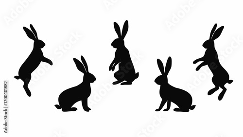 Group of five black rabbit silhouettes in various poses on white background