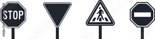 Set of four common road traffic signs including stop pedestrian crossing and yield signs silhouette