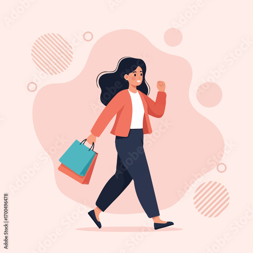 A joyful woman strides confidently, shopping bags in hand, against a soft pink background, radiating happiness and success.