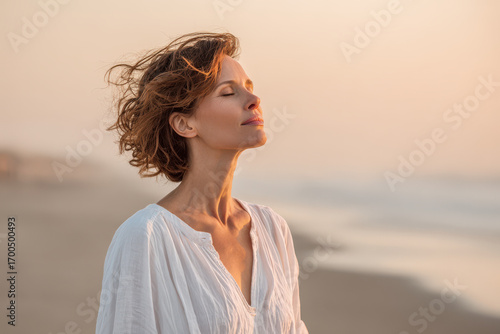 woman is performing breathing exercise gazing upward with tranquil expression against clean bright background