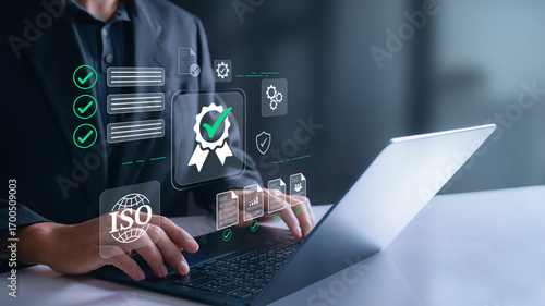 Foto Business professional on laptop showing ISO certification and compliance process