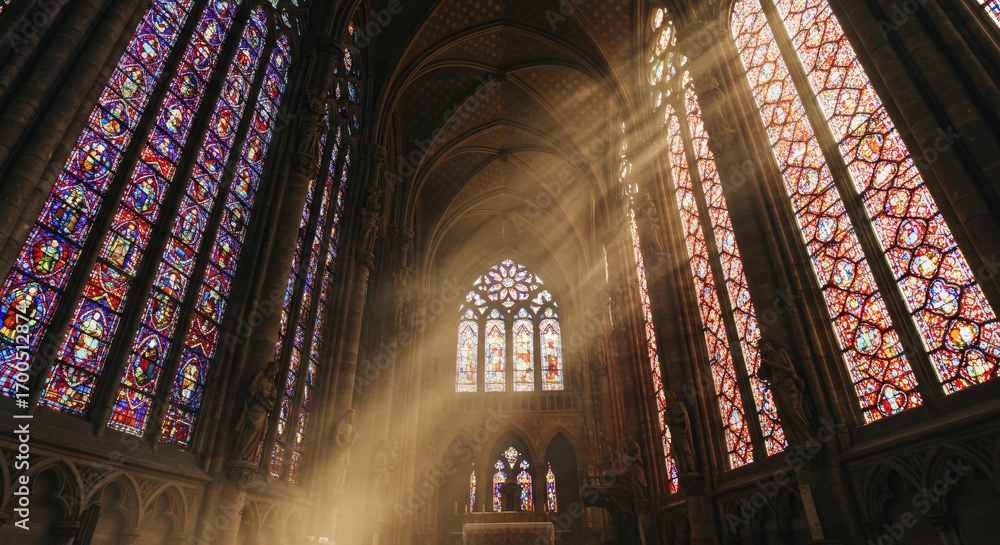 Fototapeta premium Sunlit cathedral beams illuminate the nave