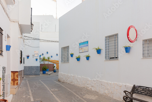 Conil de la Frontera, Cadiz, Andalusia, Spain. 6 September 2025. Traditional Andalusian street with flowerpots