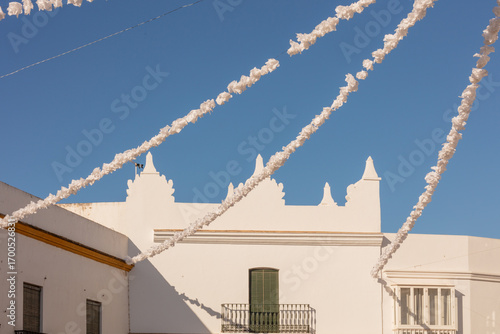 Conil de la Frontera, Cadiz, Andalusia, Spain. 6 September 2025. Whitewashed building with festival decorations