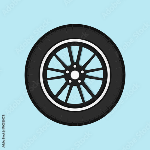 A stylized illustration of a car tire with a silver rim and a black rubber tread, set against a light blue background.
