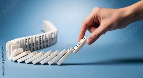 Domino Effect, Hand Starting Chain Reaction, Risk Management Concept