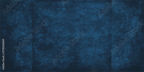 Dark and textured, this blue grunge wall background is a vintage pattern with a dirty, aged feel