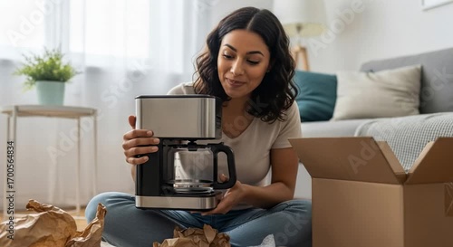 Latin woman unpacking online order at home with new coffee maker