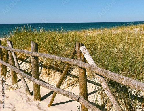 wooden fence on the beach, view of the city of the sea, French riviera