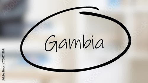 Gambia Handwriting using black marker on glass